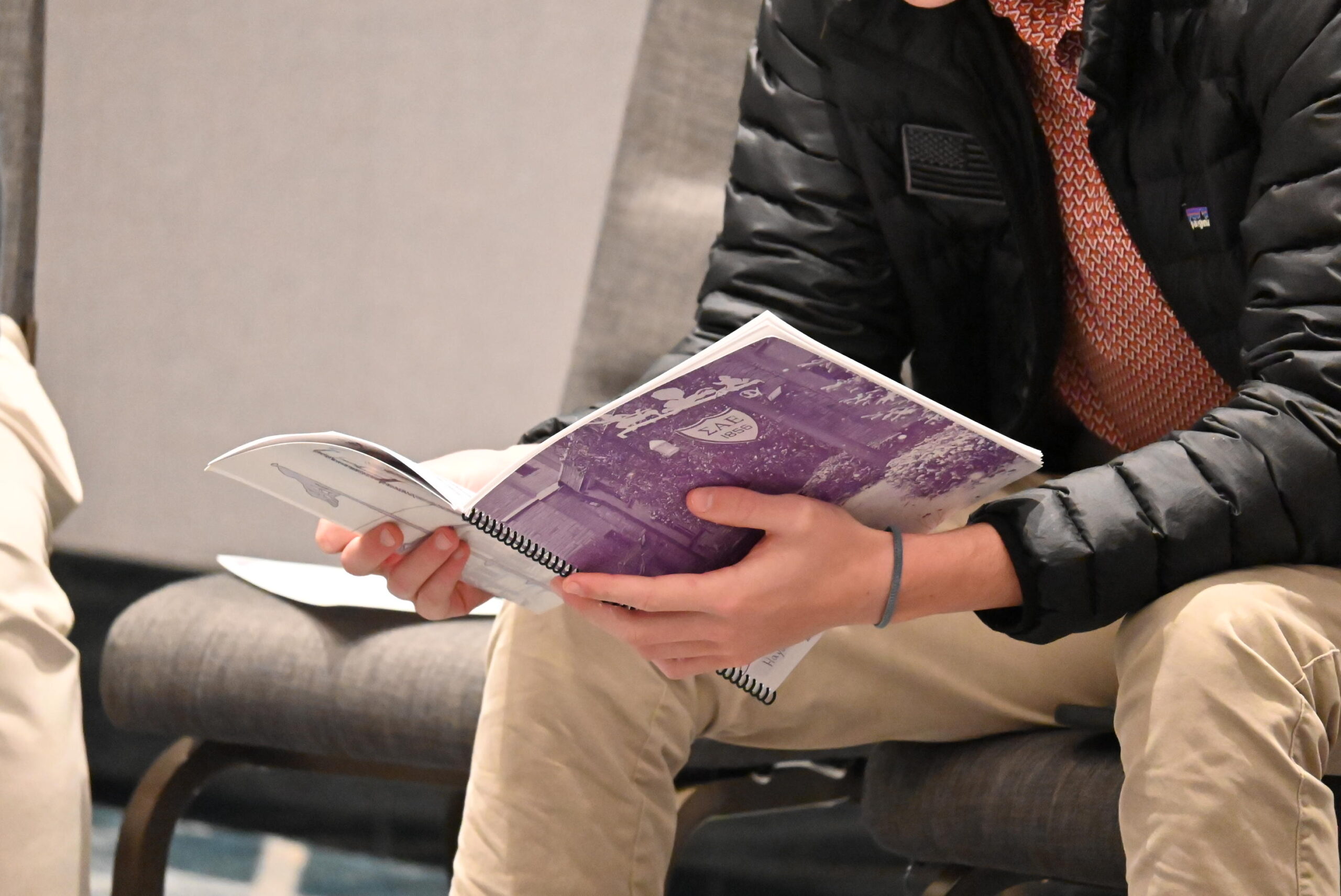 SAE brother holding leadership notebook