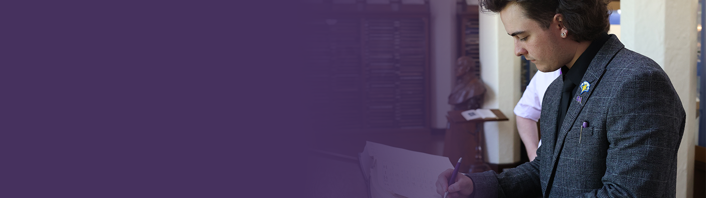 SAE Brother Signing Visit Book at the Levere Memorial Temple